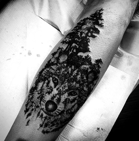Tattoos of wolves in forests